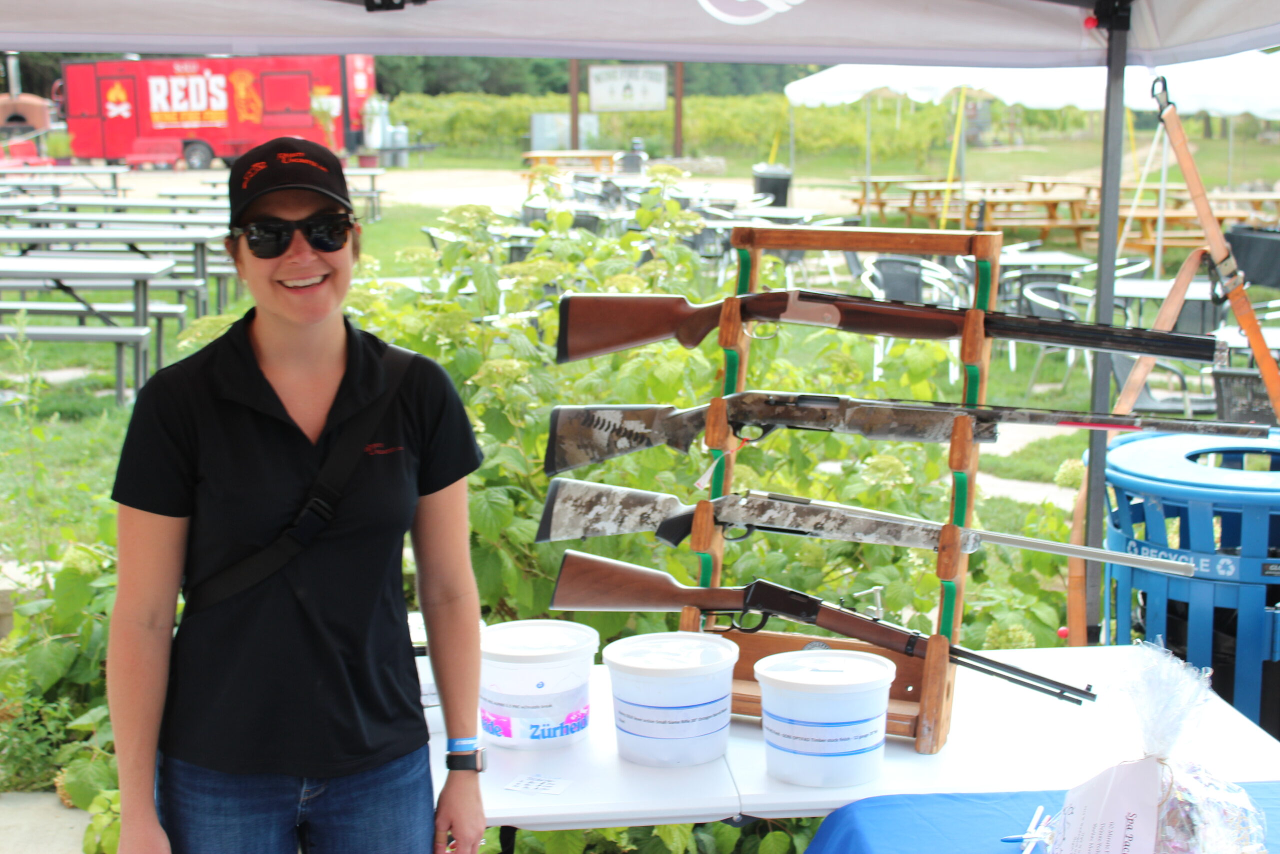 A volunteer welcoming guests at a Rabbits Unlimited community fundraiser