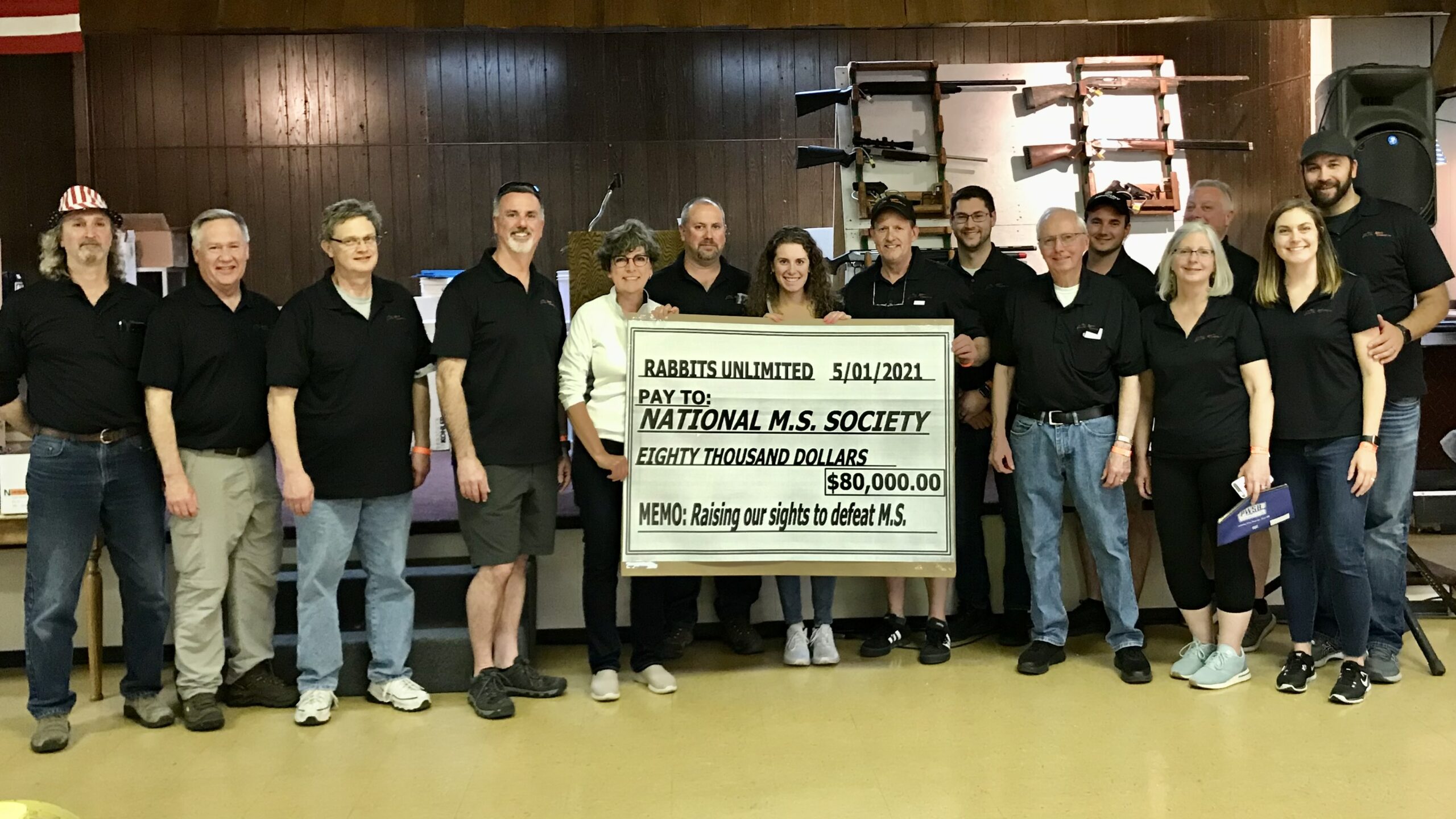 Rabbits Unlimited volunteers presenting an $80,000 donation to the National MS Society